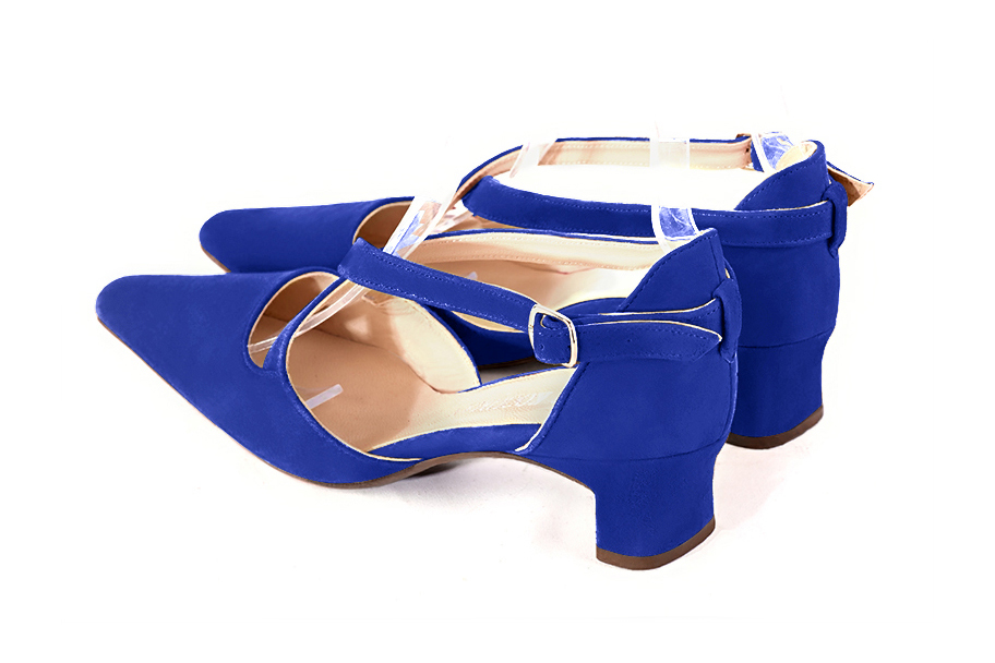 Women's electric blue open side dress shoes, with crossed straps. Tapered toe. Low kitten heels - Rear view